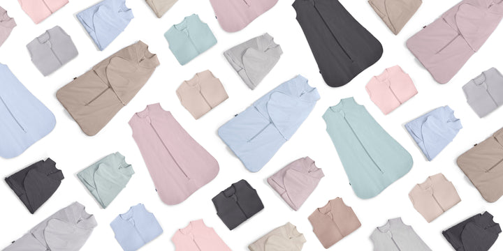 A seamless pattern of baby sleep sacks and pajama sets in various pastel colors including blue, pink, beige, grey, and green, arranged diagonally on a white background.