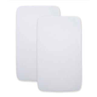 Two HALO BassiNest® Beside Sleeper fitted sheets, 100% organic cotton, are shown slightly overlapping each other on a white background. Set includes 2 plain white rectangular sheets.