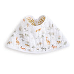 The aden + anais essentials cotton muslin burpy bib is a white, full-coverage bib featuring colorful giraffes, lions, and elephants. Made from absorbent muslin, it has an inner lining with a playful yellow and white dotted pattern.