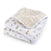 The essentials cotton muslin dream blanket by aden + anais is perfect for tummy time, featuring a cozy, enchanting animal and nature print with lions, turtles, and trees in muted hues. The reverse side has a delightful yellow scattered leaf pattern.