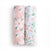The aden + anais essentials cotton muslin swaddle blanket 2 pack includes two versatile blankets: one with a pink background adorned with large white flowers and green leaves, and the other featuring a white background with small green leaves and peach flowers, perfect for babies.