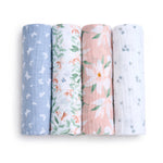 Explore aden + anais essentials cotton muslin swaddle blanket 4 pack, featuring designs like blue with white butterflies, white with orange and green leaves, pink with large white flowers and green leaves, and a classic white sprinkled with small blue floral prints.