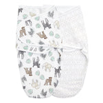 The aden + anais essentials swaddle wrap quick change 2 pack includes two baby swaddles with adjustable fasteners for secure and comfy wrapping—one adorned with safari animals and leaves, and the other featuring a beige geometric diamond pattern. Both Easy Swaddle Wraps are shown side by side against a white background.