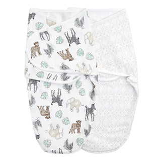 The aden + anais essentials swaddle wrap quick change 2 pack includes two baby swaddles with adjustable fasteners for secure and comfy wrapping—one adorned with safari animals and leaves, and the other featuring a beige geometric diamond pattern. Both Easy Swaddle Wraps are shown side by side against a white background.