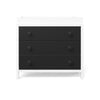 A modern Child Craft dresser with three spacious black drawers and round knobs in a white frame is paired with the Child Craft F01792 Universal Changing Table Topper in Lunar Gray, all set against a plain white background.