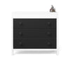A modern Child Craft dresser with three large black drawers, a white frame, and round black knobs. Two pump bottles sit on top, making it simple to add the Child Craft F01792 Universal Changing Table Topper in Lunar Gray for convenience.
