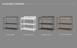 Four Flat Top Baby Changing Tables by Child Craft are side by side on a gray background, each featuring baby-safe finishes in cool gray, matte white, dapper gray, and dusty heather. The text above reads: "Available Finishes—perfect nursery storage for any style.