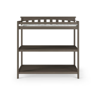 The Child Craft Flat Top Baby Changing Table in Dapper Gray features a top baby changing pad and two open storage shelves, shown against a white background.