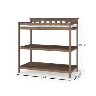 The Child Craft Flat Top Baby Changing Table in Dusty Heather features a padded changing pad top and two open shelves for nursery storage. It measures 36.19"H x 37.9"W x 19.55"D.