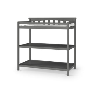 The Child Craft Flat Top Baby Changing Table in Cool Gray features baby-safe finishes, a cushioned changing pad, two open shelves for storage, and raised back and sides for added safety.