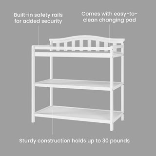 The Child Craft Arch Top Baby Changing Table in matte white features built-in safety rails, two storage shelves, and an easy-to-clean pad, offering secure, ample storage for baby essentials. Shown on a gray background.