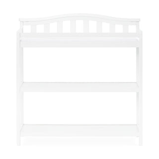 The Child Craft Arch Top Baby Changing Table in matte white features a curved top rail, vertical back slats, and two open shelves for storage, shown against a white background.