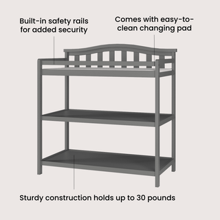 The Child Craft Arch Top Baby Changing Table in Cool Gray features two shelves, built-in safety rails, a sturdy design supporting up to 30 lbs, and an easy-to-clean changing pad included.