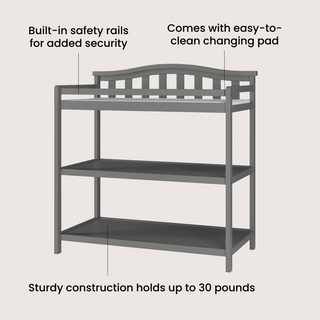 The Child Craft Arch Top Baby Changing Table in Cool Gray features two shelves, built-in safety rails, a sturdy design supporting up to 30 lbs, and an easy-to-clean changing pad included.