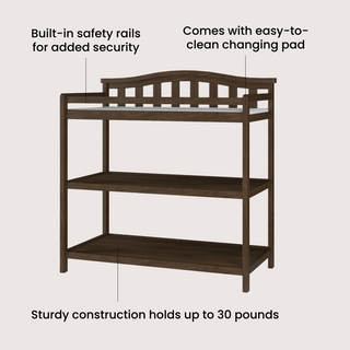 The Child Craft Arch Top Baby Changing Table in Slate features two open shelves, built-in safety rails, a comfy pad, and holds up to 30 lbs—an essential nursery piece for safe, organized diaper changes.