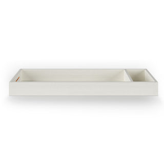 The Child Craft Legacy Changing Table Topper in Vintage Linen is a rectangular white wooden tray with two front-facing compartments of different sizes, shown against a plain white background.