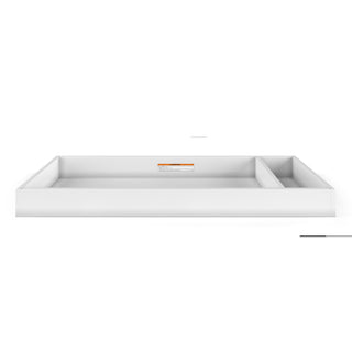 The Legacy Changing Table Topper by Child Craft in matte white is a rectangular dresser tray with two compartments—one larger on the left, one smaller on the right—shown from the front against a plain white background.