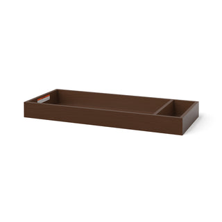 The Child Craft F01792 Universal Dressing Kit in Toasted Chestnut is a rectangular wooden baby changing tray with two compartments, one larger than the other, and features a small label on the inside edge.