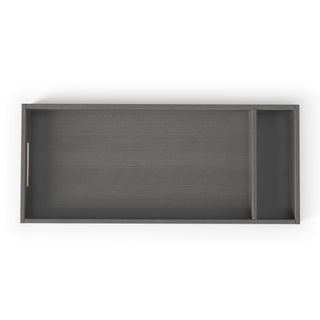 The F01792 Universal Changing Table Topper by Child Craft is a rectangular, midnight gray tray with two compartments—one large, one small—and a left-side cutout handle, designed to fit on top of a dresser.