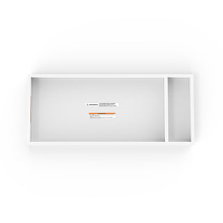 The Child Craft F01792 Universal Changing Table Topper in matte white features a rectangular design with two compartments—one large, one narrow—and visible warning labels. Shown from above on a white background.