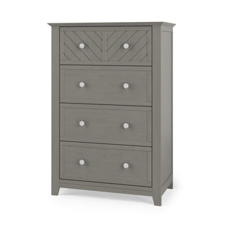 The Child Craft Atwood 4-Drawer Chest in Lunar Gray features a modern, clean-lined design with silver hexagonal knobs and a geometric chevron pattern on the top drawer.