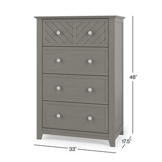 The Child Craft Atwood 4-Drawer Chest in Lunar Gray features four drawers with white knobs, a chevron-patterned top drawer, and measures 48"H x 33"W x 17.5"D.