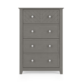The Child Craft Atwood 4-Drawer Chest in Lunar Gray features four spacious drawers, silver hexagonal knobs, a chevron pattern on the top drawer, and stands on short legs.