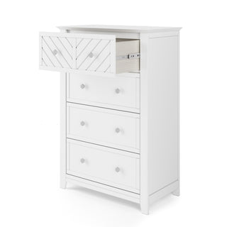 The Child Craft Atwood 4-Drawer Chest in Matte White is a nursery dresser with baby-safe finishes; its chevron-patterned top drawer is partially open, while the other three plain drawers are closed.
