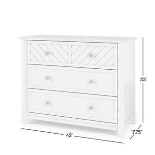 The Child Craft Atwood 3-Drawer Dresser in Matte White features a modern design with an angled top drawer, round knobs, and dimensions of 33"H x 42"W x 17.75"D.
