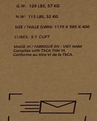 A close-up of the label on the Child Craft Redmond Full Panel 4-in-1 Convertible Crib (Coach Cherry) shows weight (G.W. 126 lbs/57 kg, N.W. 115 lbs/52 kg), size (1175 x 585 x 400 mm), 9.7 cuft, made in Vietnam, plus TSCA compliance.