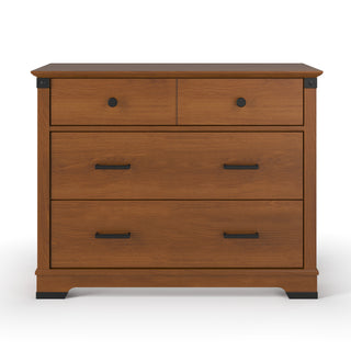 The Child Craft Redmond 3 Drawer Dresser in Coach Cherry features two top drawers with round black knobs and a large lower drawer with rectangular black handles, all set against a white background.