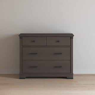 A Child Craft Redmond 3 Drawer Dresser in Dapper Gray features three spacious drawers, sleek handles, and a modern design—ideal for use as a nursery dresser.