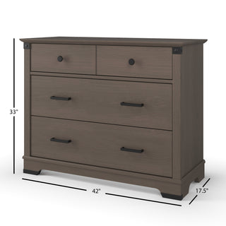 The Child Craft Redmond 3 Drawer Dresser in Dapper Gray features three spacious drawers with black handles, measuring 33" tall, 42" wide, and 17.5" deep—ideal for storing your child's essentials in the nursery.