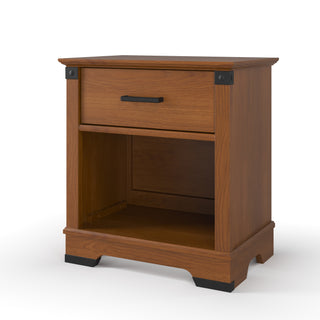 The Child Craft Redmond Nightstand in Coach Cherry features a single drawer with a black handle, an open shelf, black corner accents, and decorative cut-outs, making it ideal for any bedroom or nursery.