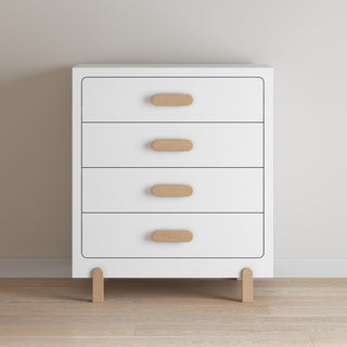 The Park Heights 4-Drawer Chest by Child Craft features a modern matte white finish, rounded edges, light wood handles, and short wooden legs. Crafted from Brazilian hardwood, it's perfect for bedrooms with light walls and wooden floors.