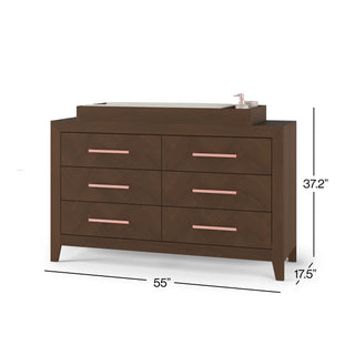 The Child Craft F01792 Universal Dressing Kit in Toasted Chestnut is a wooden dresser with six drawers, pink handles, a baby changing tray, and lotion dispenser. It measures 55"W x 37.2"H x 17.5"D.