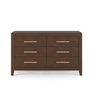 The Child Craft Kieran 6-Drawer Double Dresser in Toasted Chestnut features six drawers with sleek pink handles, shown against a plain white background.