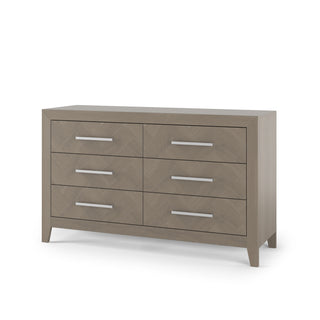 The Child Craft Kieran 6-Drawer Double Dresser in Crescent Gray features six drawers in two columns, each with a sleek silver handle, a light gray finish, and tapered legs.