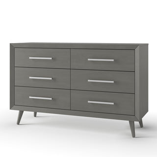 The Child Craft Cranbrook Double Dresser in Lunar Gray features six drawers, sleek metal handles, and angled legs for a mid-century modern look—ideal as stylish nursery furniture against a crisp white background.
