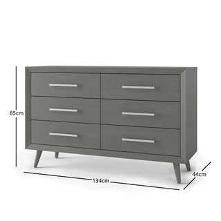 The Child Craft Cranbrook 3-Piece Nursery Set includes a grey six-drawer dresser with silver handles and angled legs, ideal for Mid Century Modern style. Dresser dimensions: 85 cm high, 134 cm wide, 44 cm deep.