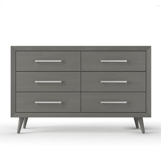 The Child Craft Cranbrook Double Dresser in Lunar Gray features six drawers, sleek metal handles, and angled legs, adding mid-century modern style to any nursery, shown against a plain white background.
