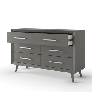 The Child Craft Cranbrook Double Dresser in Lunar Gray features six drawers, angled legs, and silver handles. Two top drawers are partially open, highlighting its stylish mid-century modern storage on a plain white background.