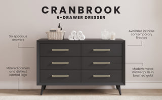 The Child Craft Cranbrook Double Dresser in Ebony features six spacious drawers with brushed gold handles. Perfect for nurseries, its modern design suits any room and can be styled with baskets, towels, or jars on top.