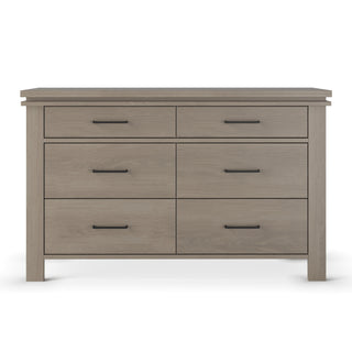The Child Craft Denman Double Dresser in Crescent Gray features six drawers in two rows of three, each with a sleek black handle.