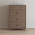 The Child Craft Soho 4 Drawer Chest in Dusty Heather features three curved black handles, a top drawer with two round knobs, and short angled legs—making it a stylish, functional choice for a modern nursery.