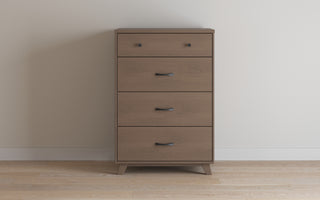The Child Craft Soho 4 Drawer Chest in Dusty Heather is a mid-century modern nursery piece with a top drawer featuring two round knobs and three drawers below with curved black handles, shown against a white wall on a light wood floor.