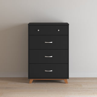 The Child Craft Soho 4 Drawer Chest in Ebony features silver handles and short wooden legs, standing against a light wall on a wooden floor.