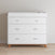The Child Craft Soho 3-Drawer Dresser in White/Natural features two small top drawers, a large bottom drawer, wooden legs, and a raised tray, and is shown against a light wall on a wooden floor.
