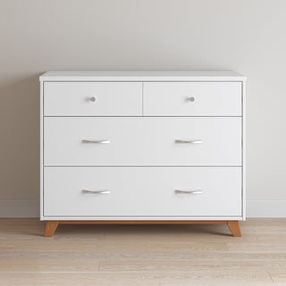 The Child Craft Soho 3-Drawer Dresser in white/natural features two small top drawers with round handles, two larger lower drawers with curved handles, and wooden legs. It stands against a light beige wall on a light wood floor.