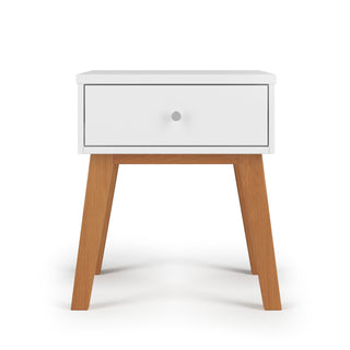 The Child Craft Soho Nightstand in White/Natural features a modern mid-century design with a single drawer and natural wooden legs, displayed against a plain white background.